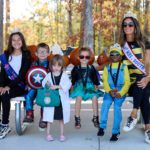 5k Costume Contest - children in costumes sitting at a picnic table.