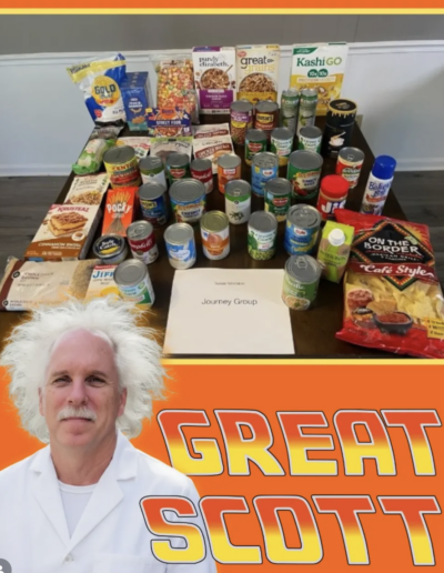 Scott's Story: Funny social media post - Scott Bowser in a white lab coat with white frizzy hair with the words "Great Scott" over a photo of tangible goods from a church food pantry.