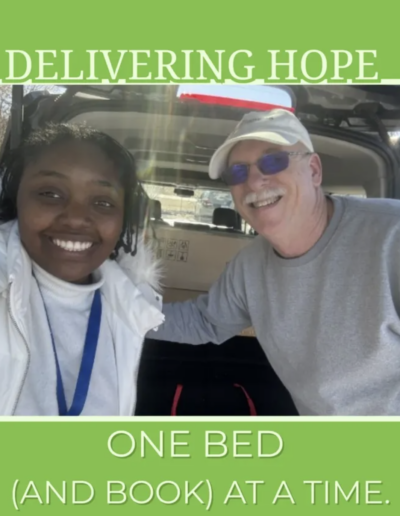 Scott Bowser in front of a vehicle delivering a bed to a family in need.